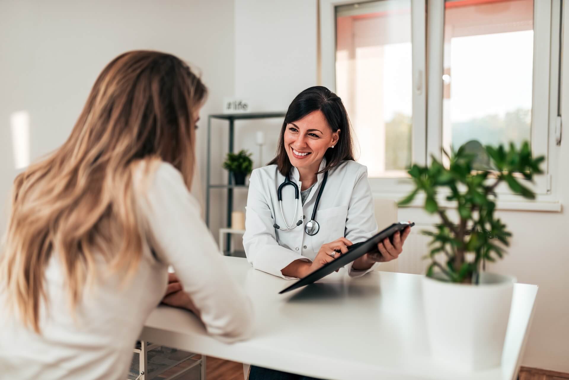Female doctor explaining fertility testing results to patient emphasizing the importance of accurate fertility diagnosis
