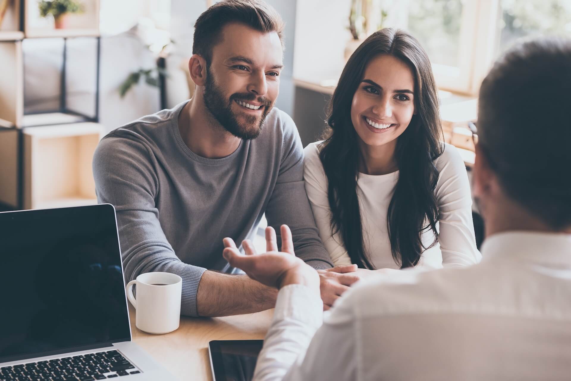 Couple meeting with fertility financial advisor to understand IUI cycle costs and treatment options
