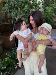 Mia Kaercher holding her twiblings Woods and Cohyn, born six weeks apart through IVF and surrogacy at The Fertility Center of Las Vegas